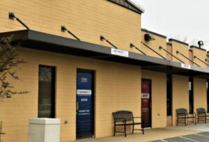 carroll architectural shade metal awnings in clinton, flat metal awnings above a store entrance