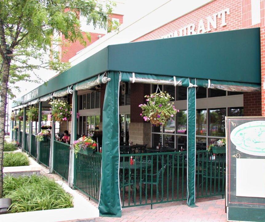 carroll architectural shade roll-up curtains attached to an outdoor patio awning