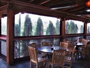 roll-down transparent curtains enclose an outdoor dining space at a restaurant